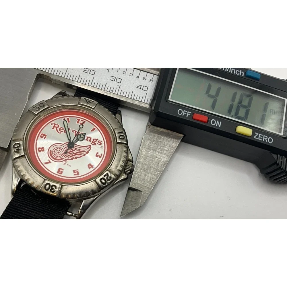 Official NHL Detroit Red wing mens watch, some light wear/age, looks & runs good